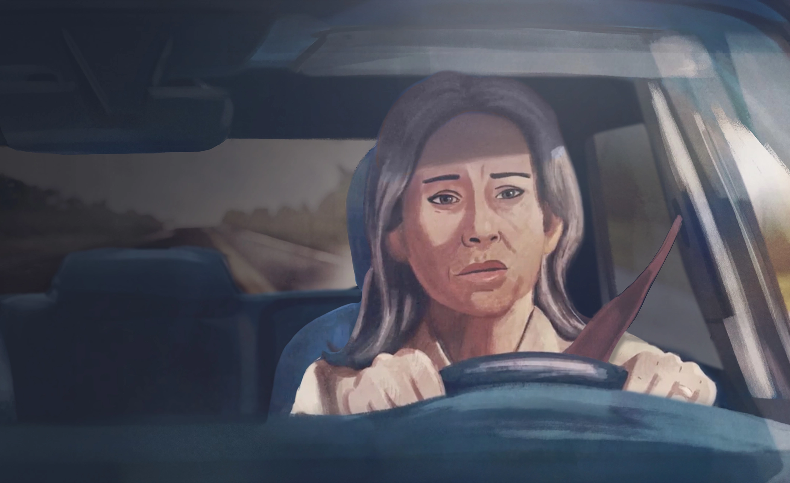 man smiling looking at a laptop screen