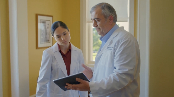 two doctors looking at an ipad
